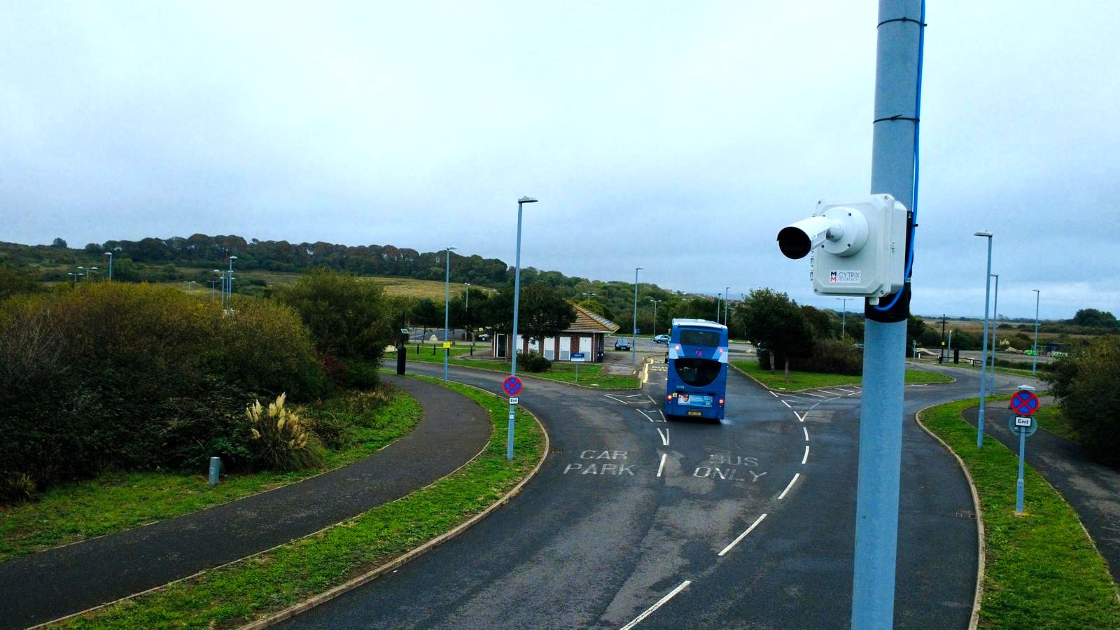 A Cytrix Micromobility unit mounted on a roadside pole overlooking a junction, monitoring bus and road traffic