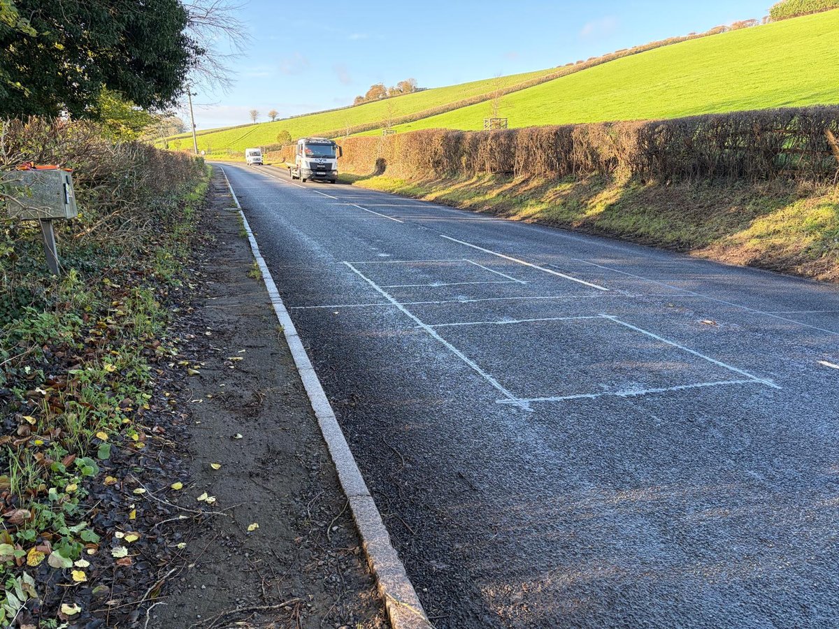 Completed inductive loop installation marked out on a rural road
